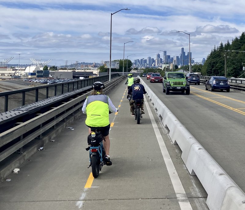 People riding through SoDo on a protected bike lane
