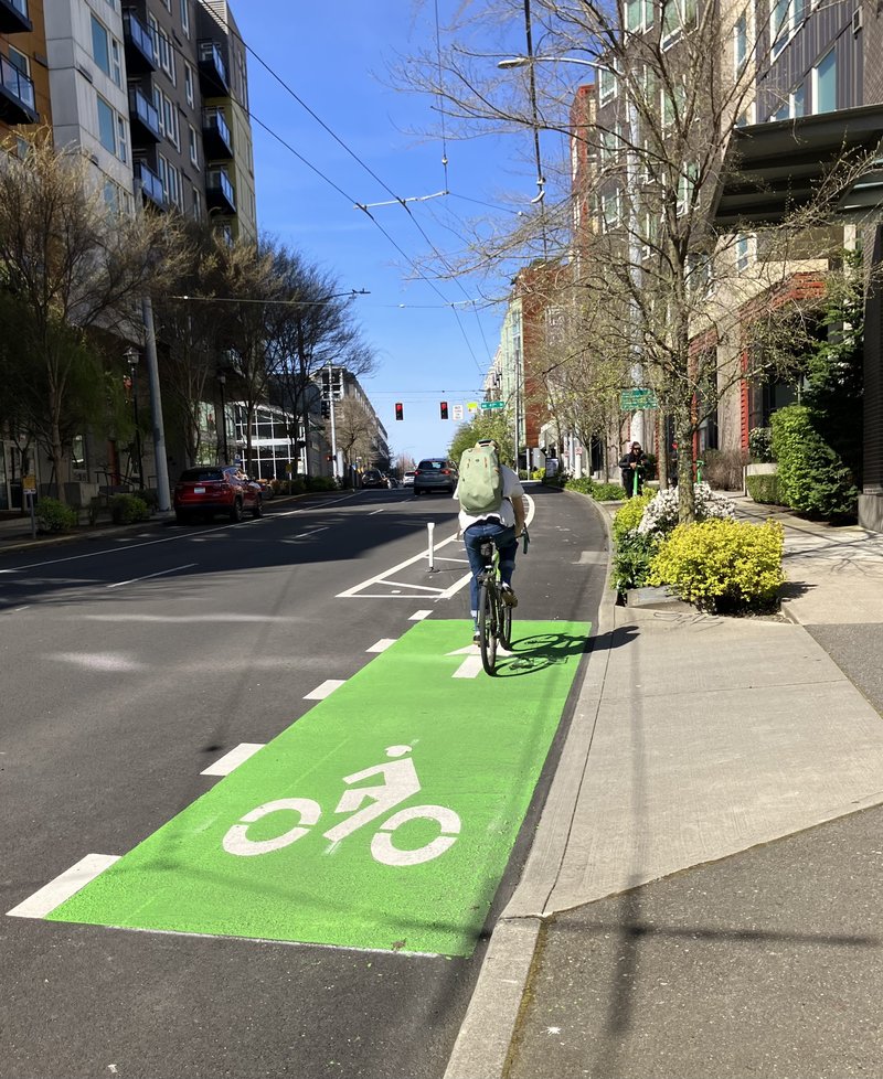 Person Biking Up 11 Ave NE