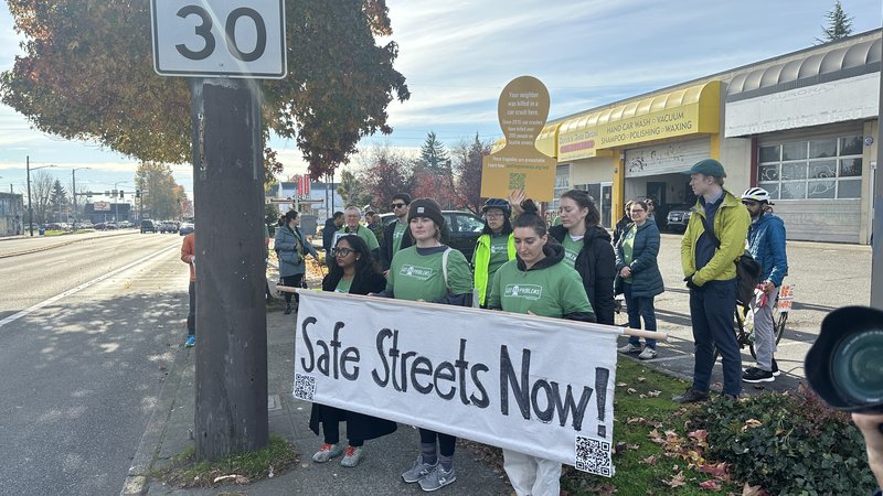 Volunteers holding Safe Streets Now banner along Aurora Ave for World Day of Remembrance 2023.