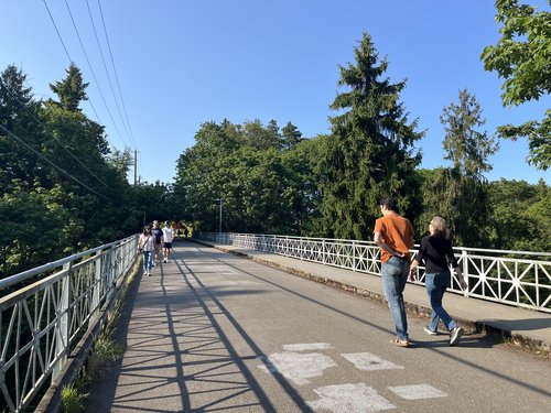 Ravenna Park bridge on 20th Avenue NE with several people walking