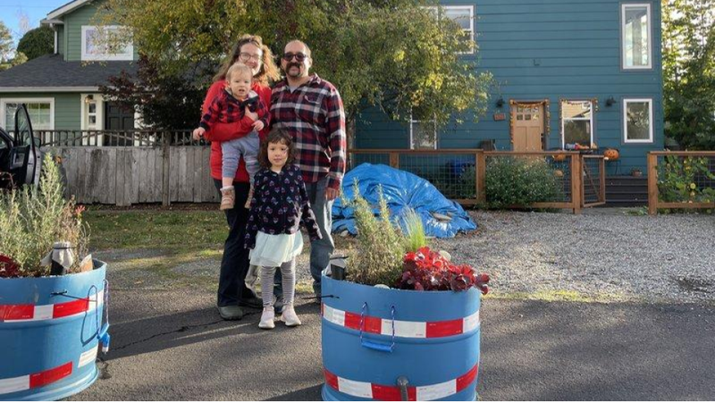 NE Greenwood Homezone - blue barrel planter traffic calming project.