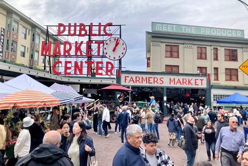 Pike Place Market crowded with pedestrians but no cars.