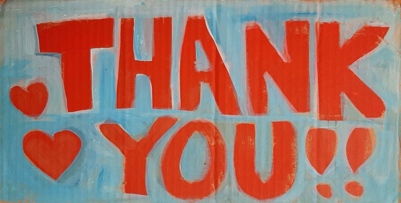 A hand-painted sign reads "Thank You!!" with hearts painted in red on a blue background.